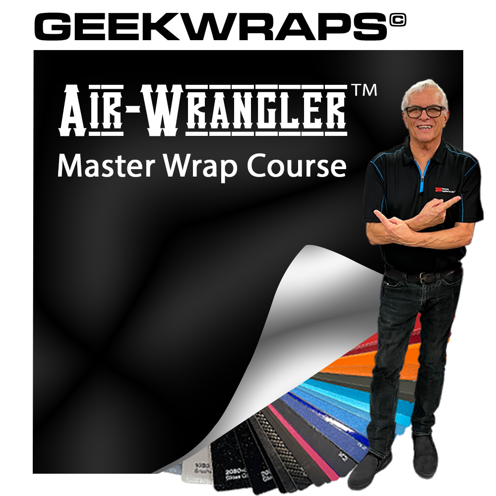Kenny Calman points to various colors of vehicle color change wrap vinyl, showcasing a range of hues and finishes for custom vehicle wraps